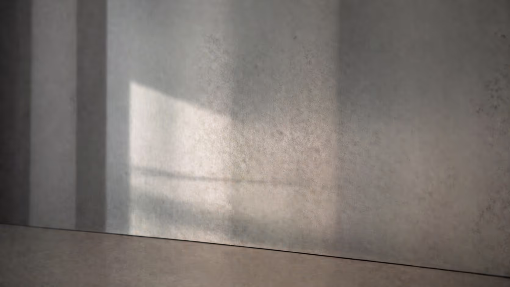 An abstract close-up of a reflective surface partially fogged or warped, where the reflection is visible but slightly off from what it should mirror.