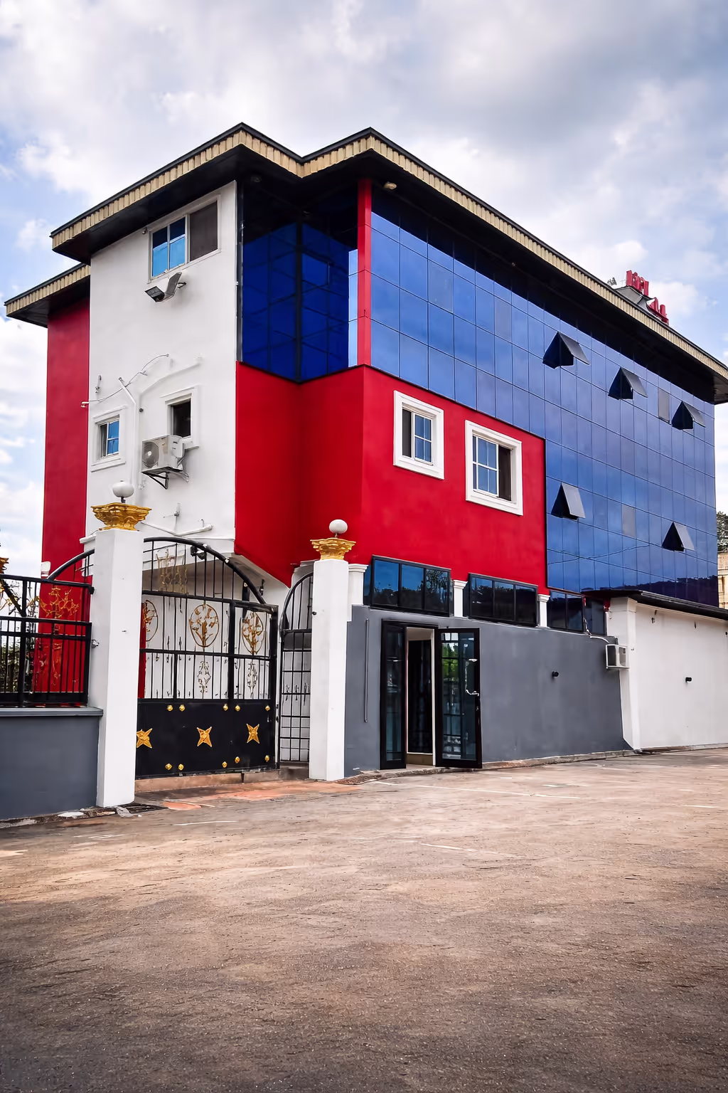 The grand and secure exterior of Hotel L'Empire Dibanda