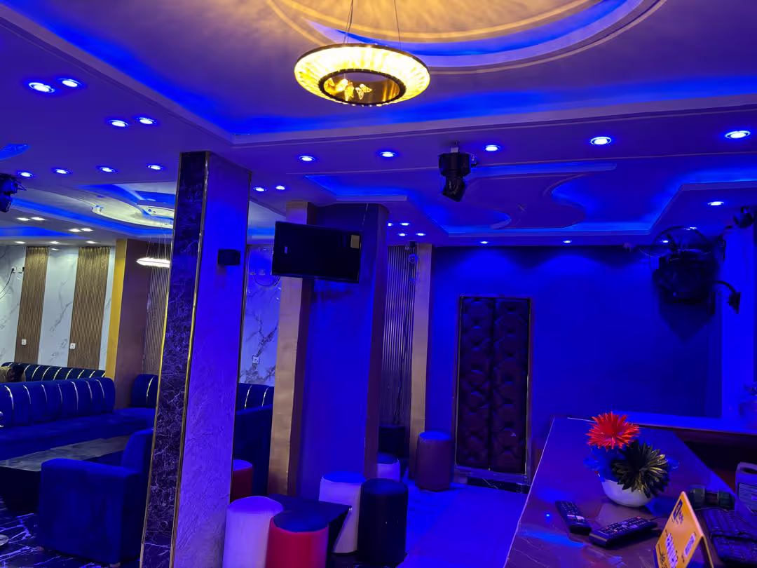 An expansive and well-appointed hotel apartment, featuring a cozy living space.