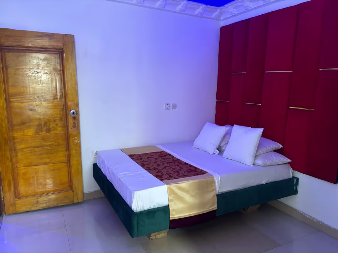 The grand and elegant exterior facade of Hotel L'Empire Dibanda, showcasing its architectural beauty.