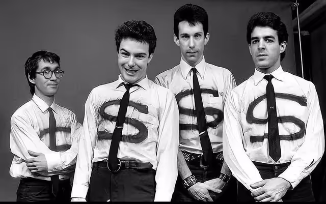 photo the band Dead Kennedys wearing dollar sign shirts