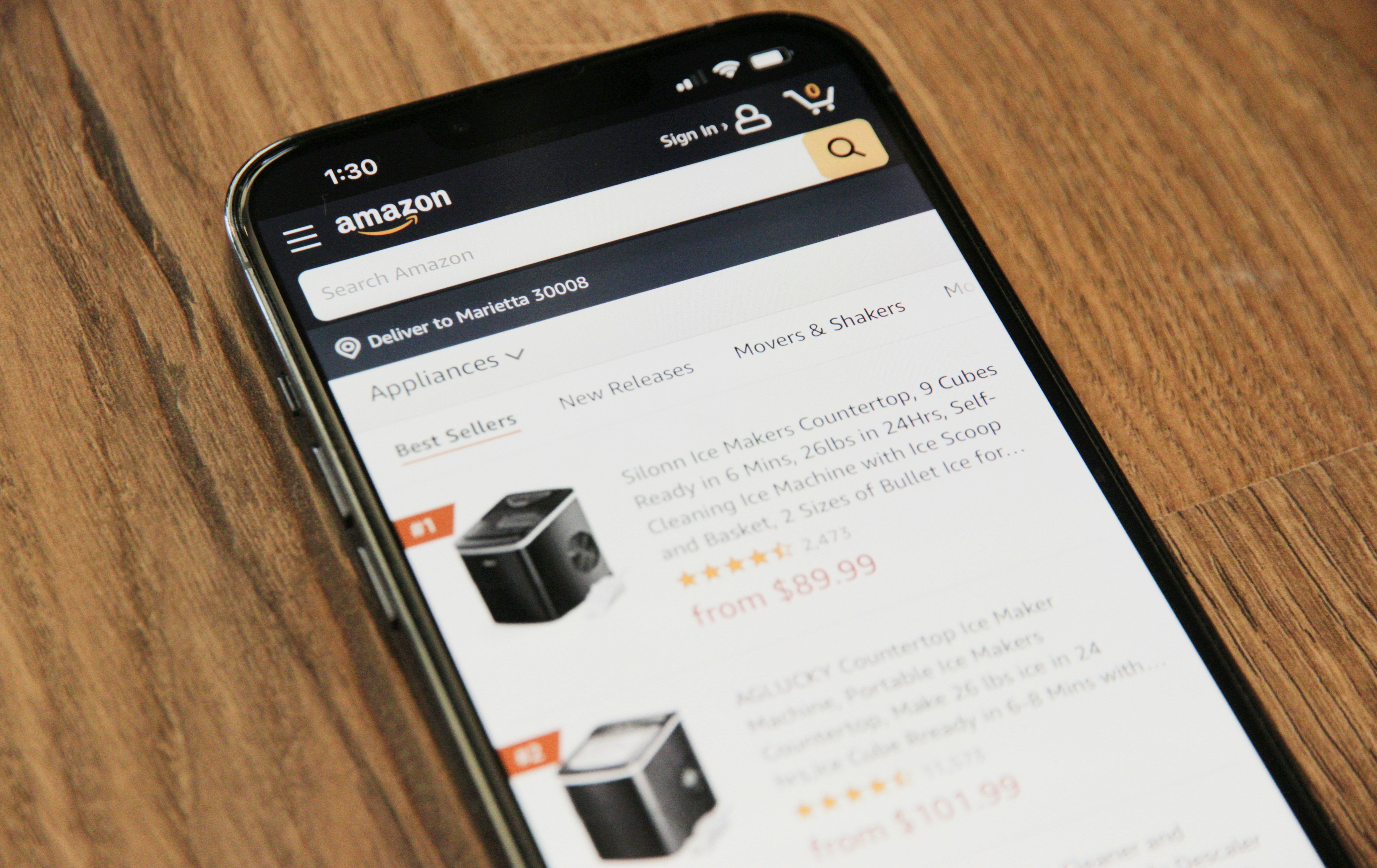 Cell phone showing an Amazon product on the app, representing a product of a strategy on how to reduce ACoS Amazon ads.
