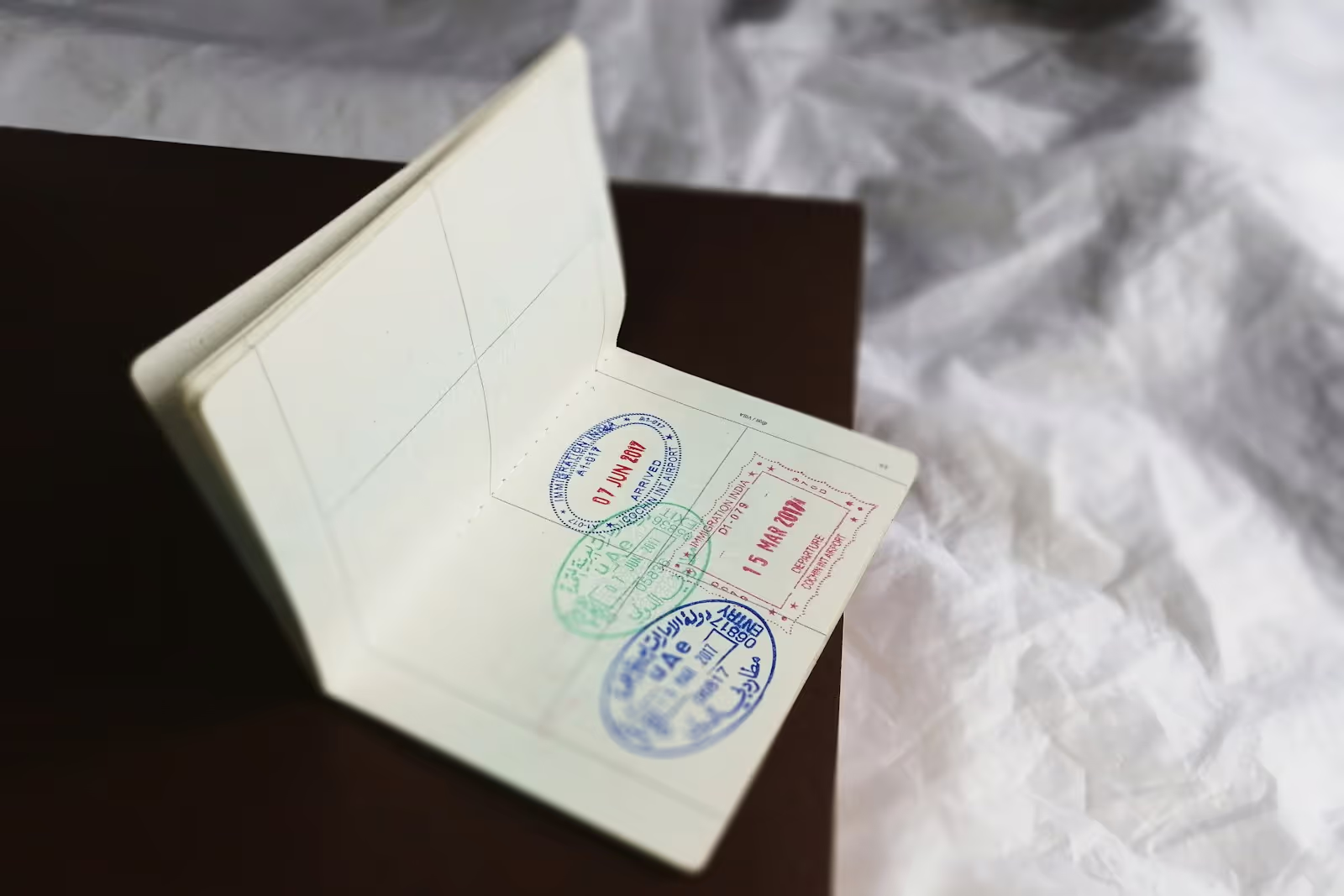 A valid government-issued photo ID next to documents ready for notarization on a desk.