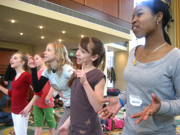 A powerful scene from a stage play with dramatic lighting