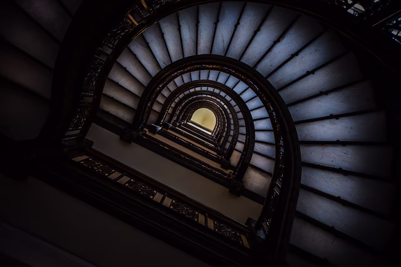 Artistic-low-angle-view-of-a-spiral-staircase-with-a-focus-on-architectural-design-and-perspective