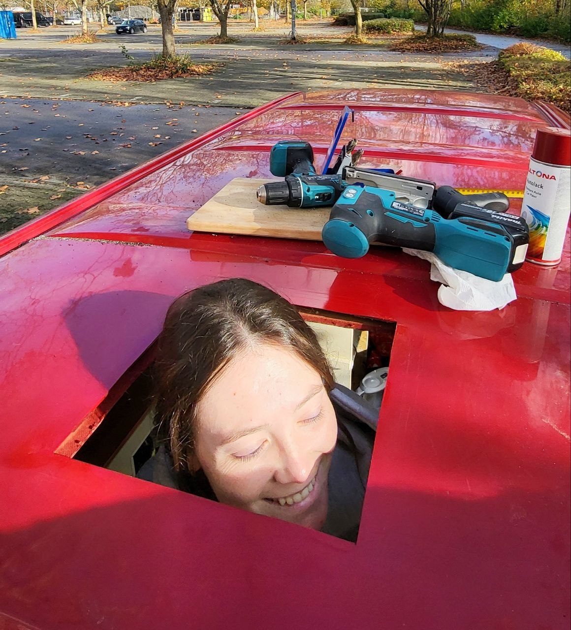 Caro sticking her head out of a hole we cut in the VW T4 