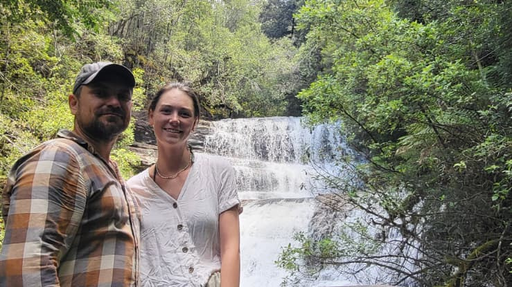 Konrad and Caro at a waterfall in Tasmania