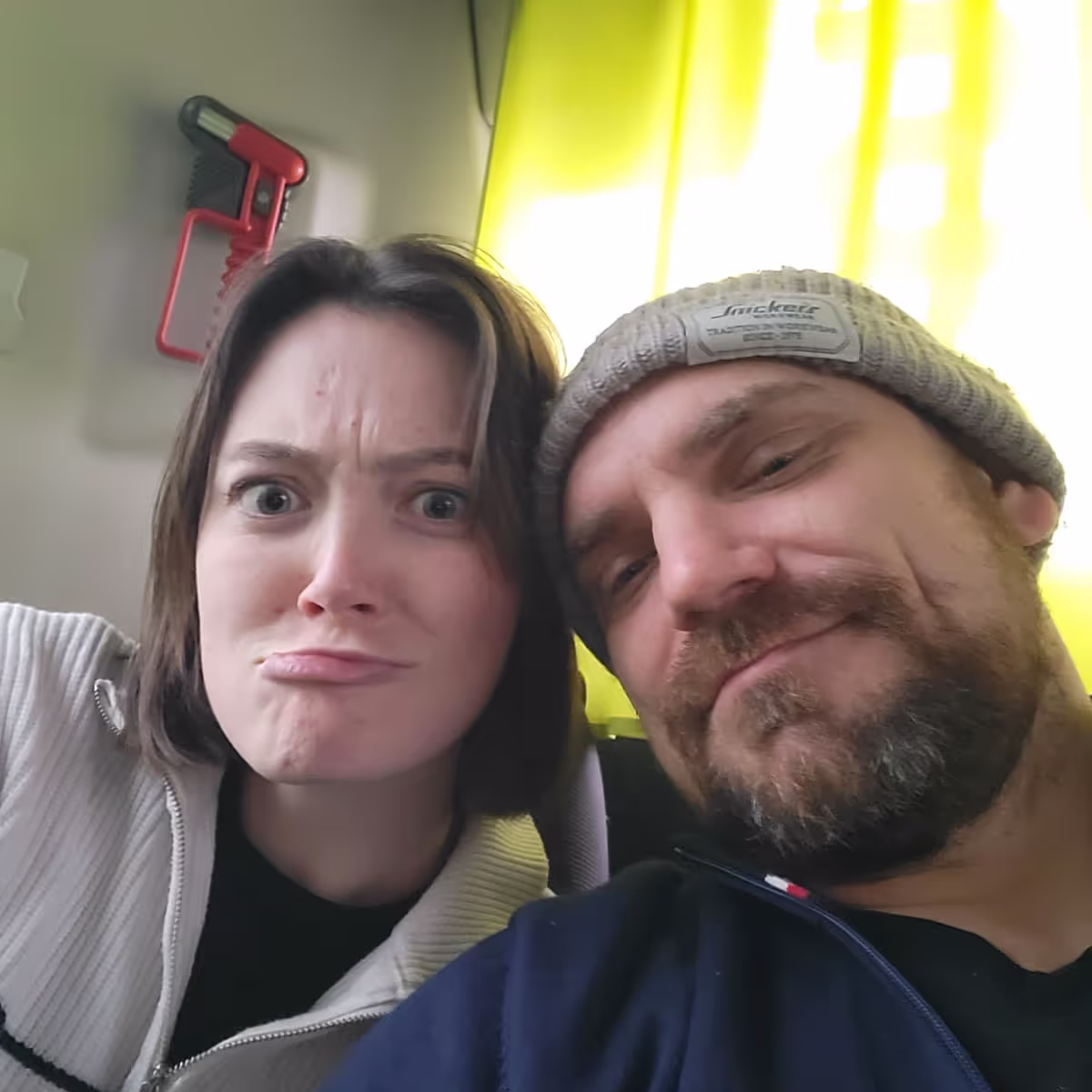 Konrad and Caro reading about the new Trusted House sitters booking Fee