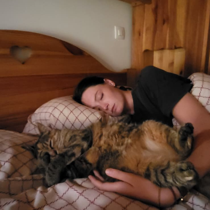 Caro falling asleep with a cat we were house sitting