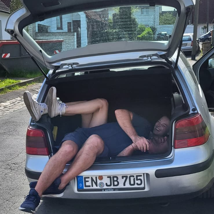 Konrad and Caro in their car in Germany