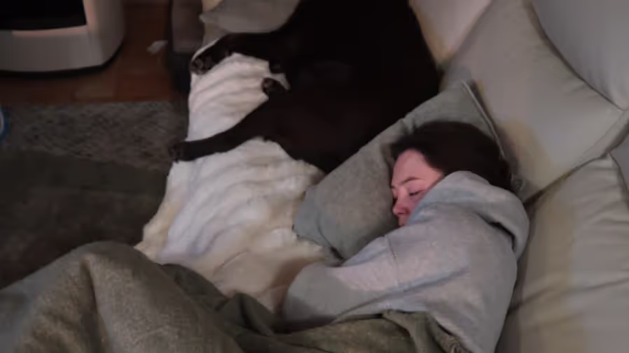 Caro falling asleep with Lucca. A dog we house sat in Italy