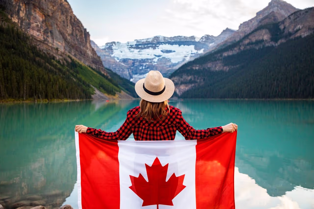 A woman in Canada with the Canadian Flag A woman in Canada with the Canadian Flag