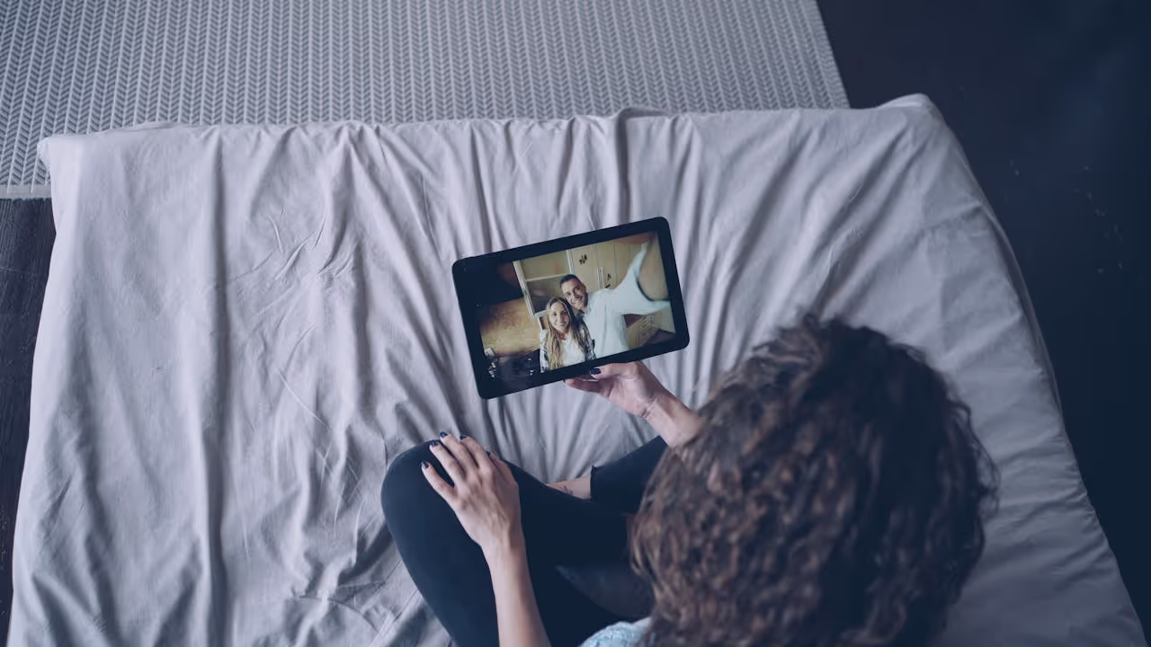 A house sitter applying for a house sit by being on a video call with the owners A house sitter applying for a house sit by being on a video call with the owners