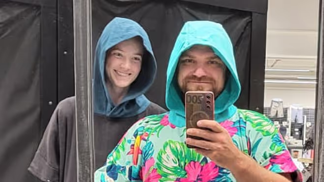 Konrad and Caro in beach ponchos