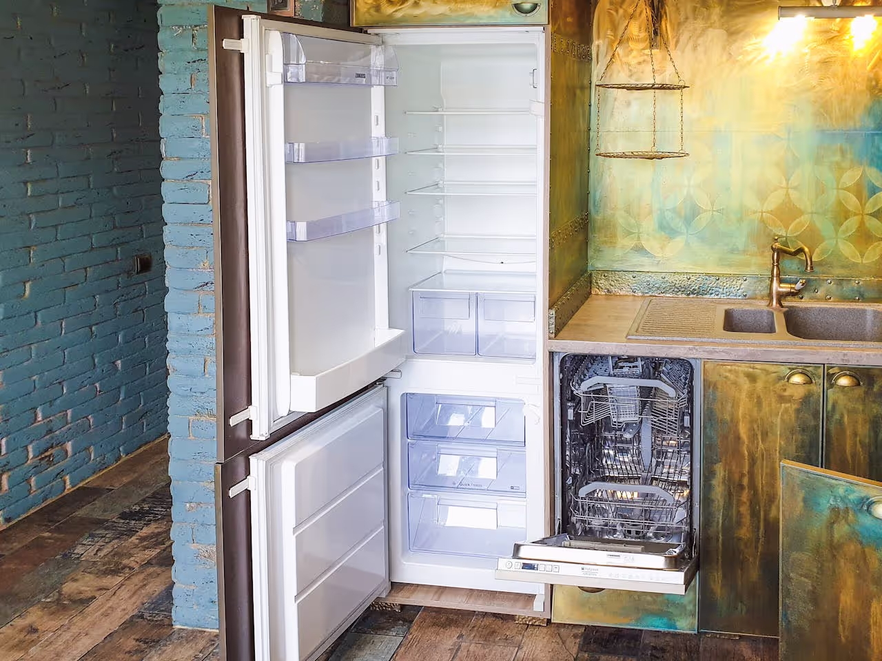 an empty kitchen and fridge