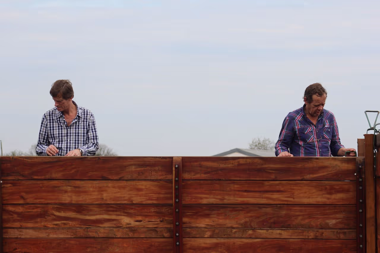 neighbours by a fence