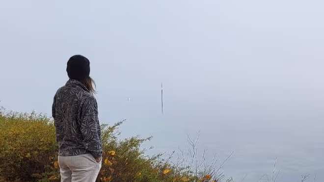 Caro standing by lake constance in Germany