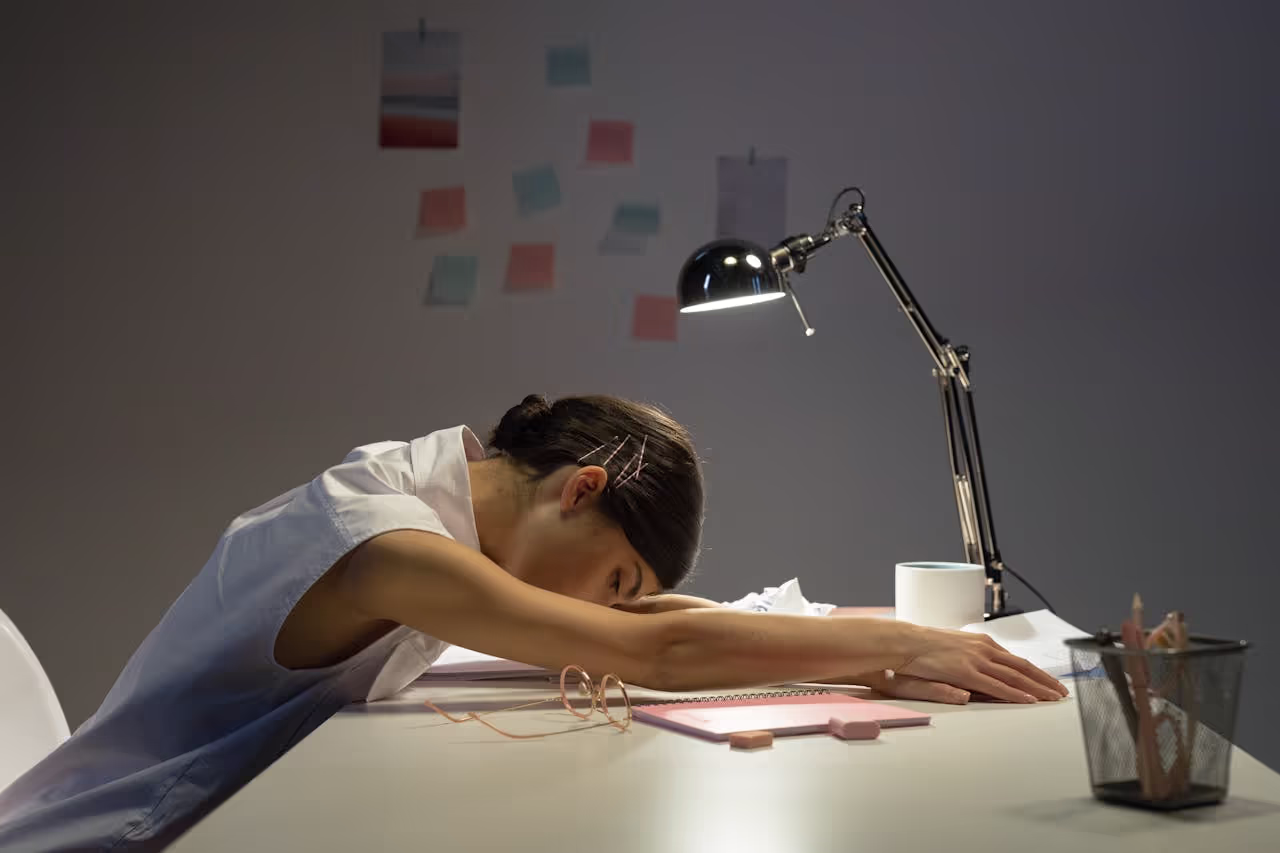 A woman laying on a bench with sleep deprivation A woman laying on a bench with sleep deprivation