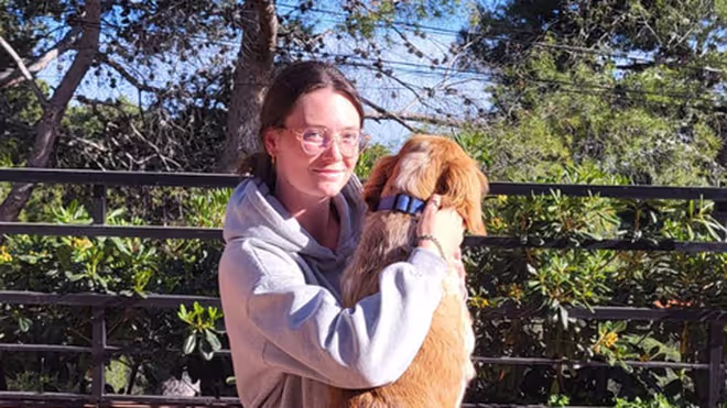 Caro with a dog during a house sit