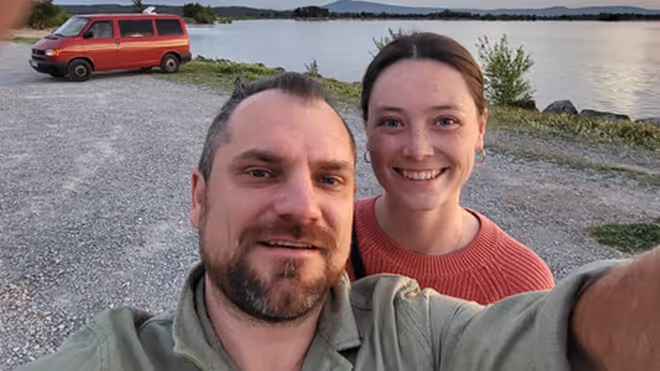 Konrad and Caro sitting in the VW T4 Campervan