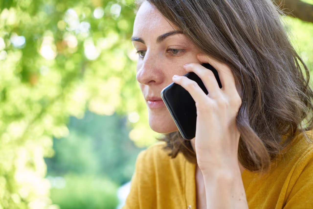 A person calling and waiting for someone to respond A person calling and waiting for someone to respond