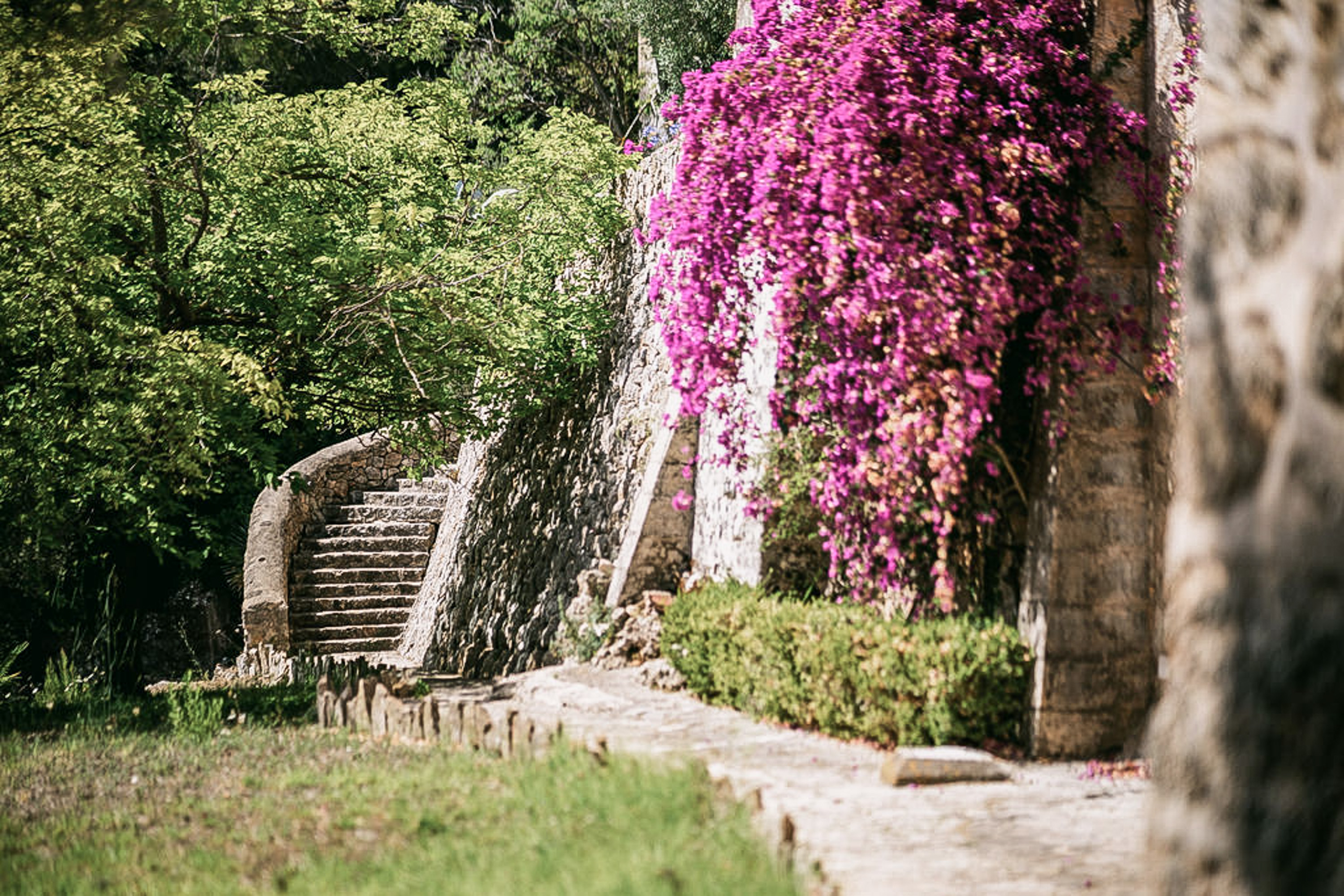 A guest relaxing in a tranquil garden, embodying slow design
