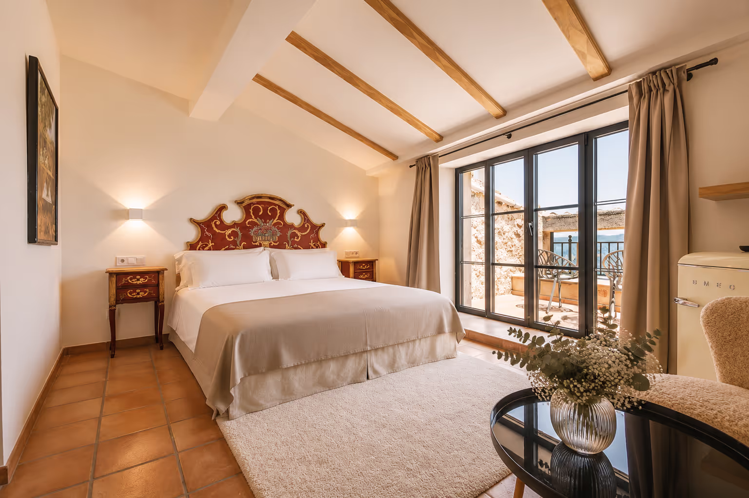 A luxurious Junior Suite with a private balcony, offering stunning scenic views.