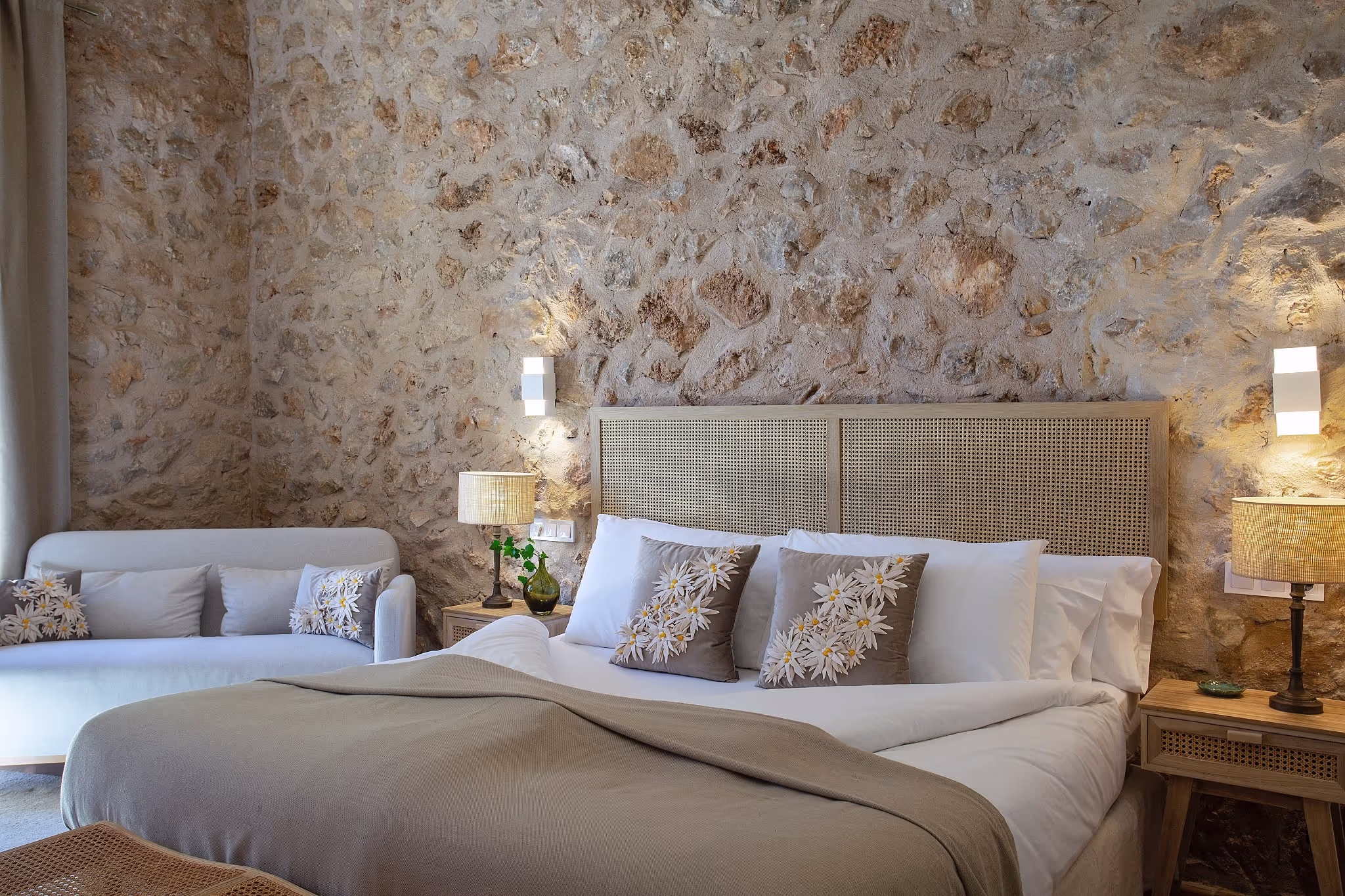 A close-up view of the king-size bed in the Junior Suite, highlighting the luxurious bedding and elegant headboard.