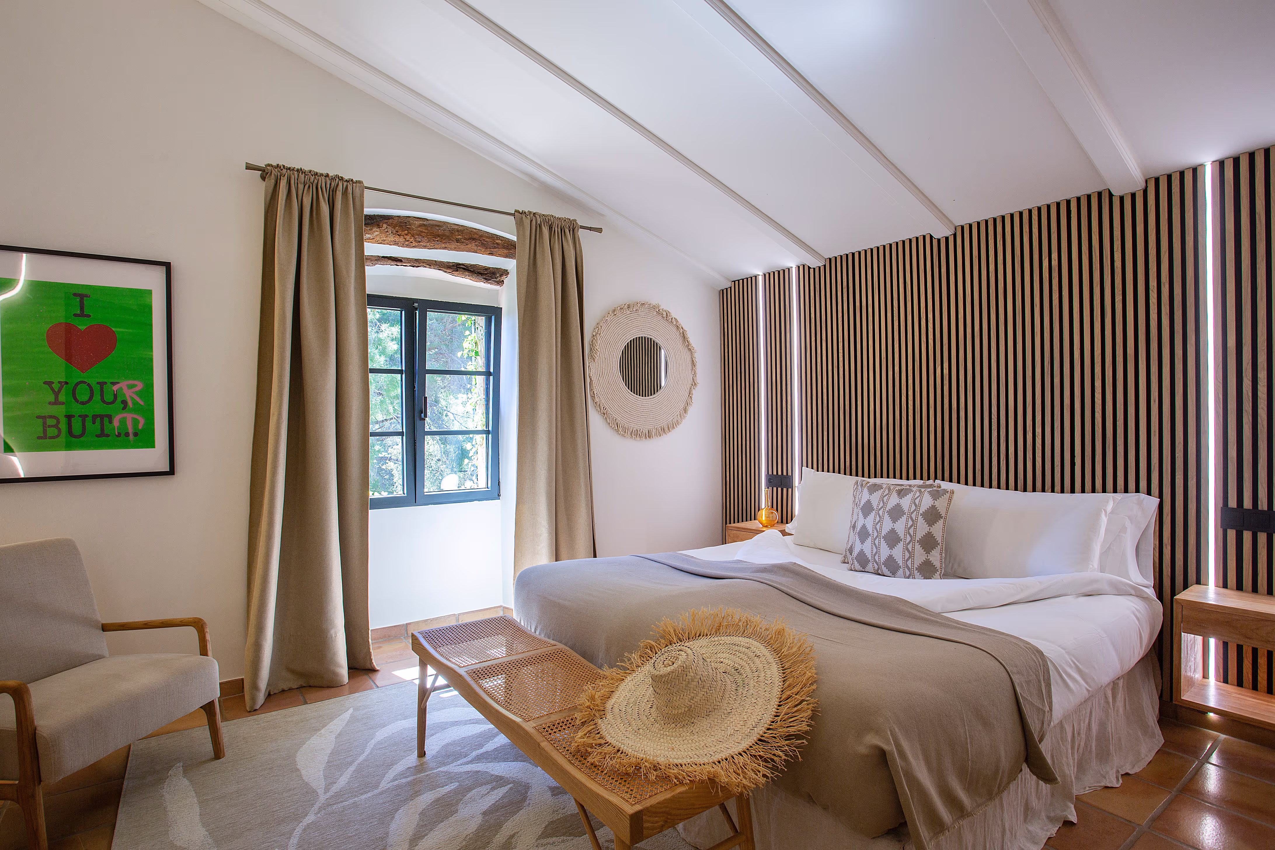 Elegant Deluxe Double Room with a large king-size bed and modern decor