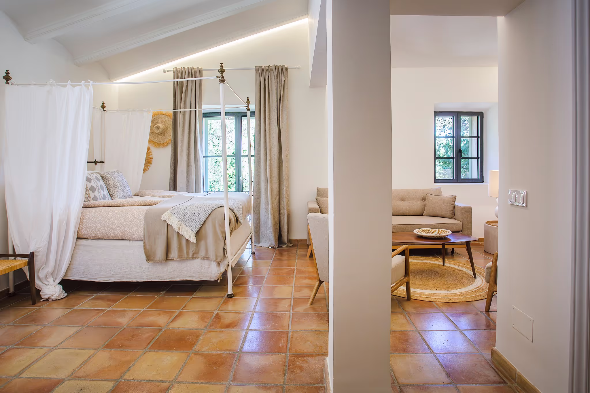 Luxurious king-size bed with pristine white linens and decorative pillows