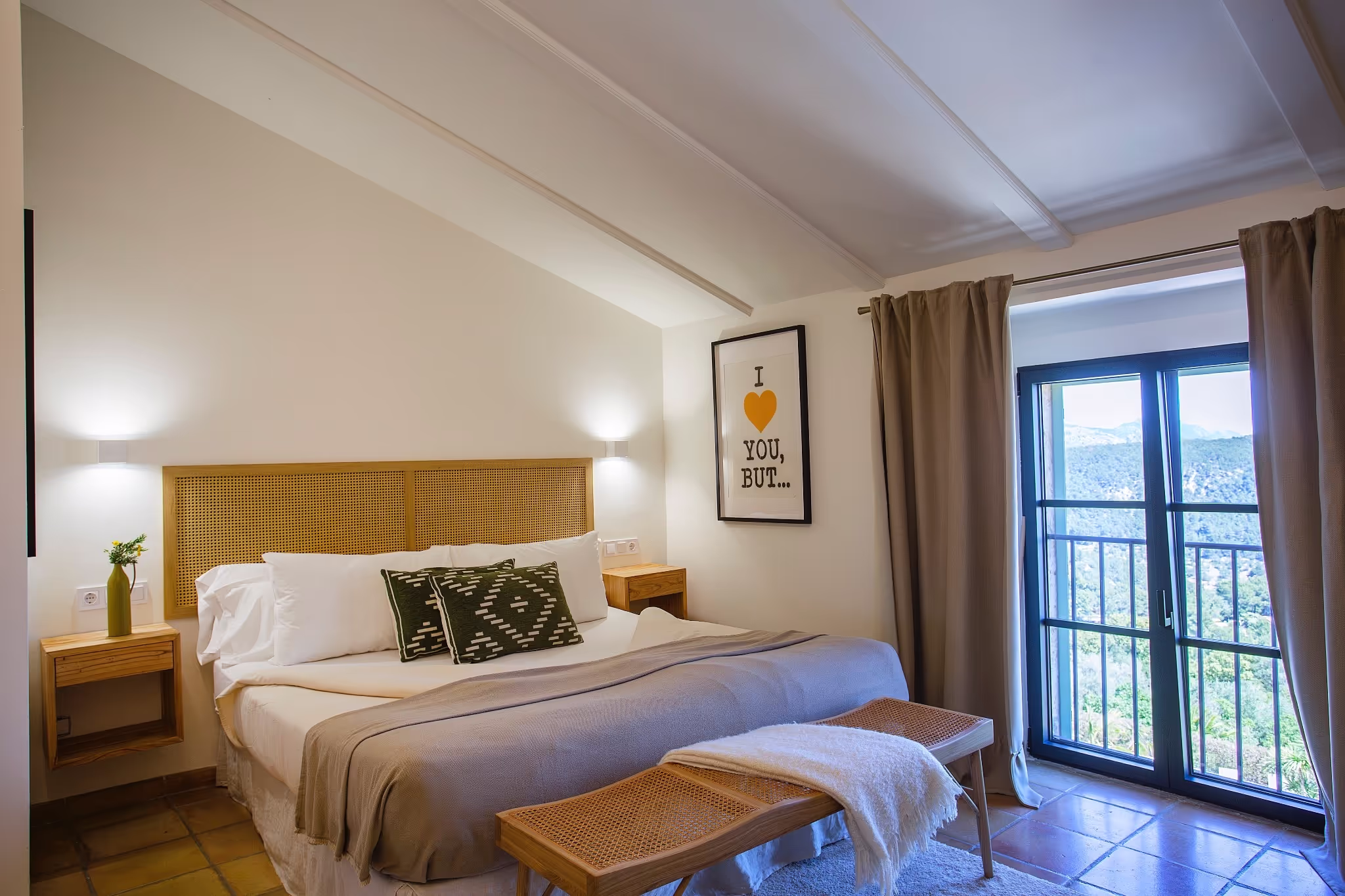 Luxurious king-size bed with pristine white linens and decorative pillows