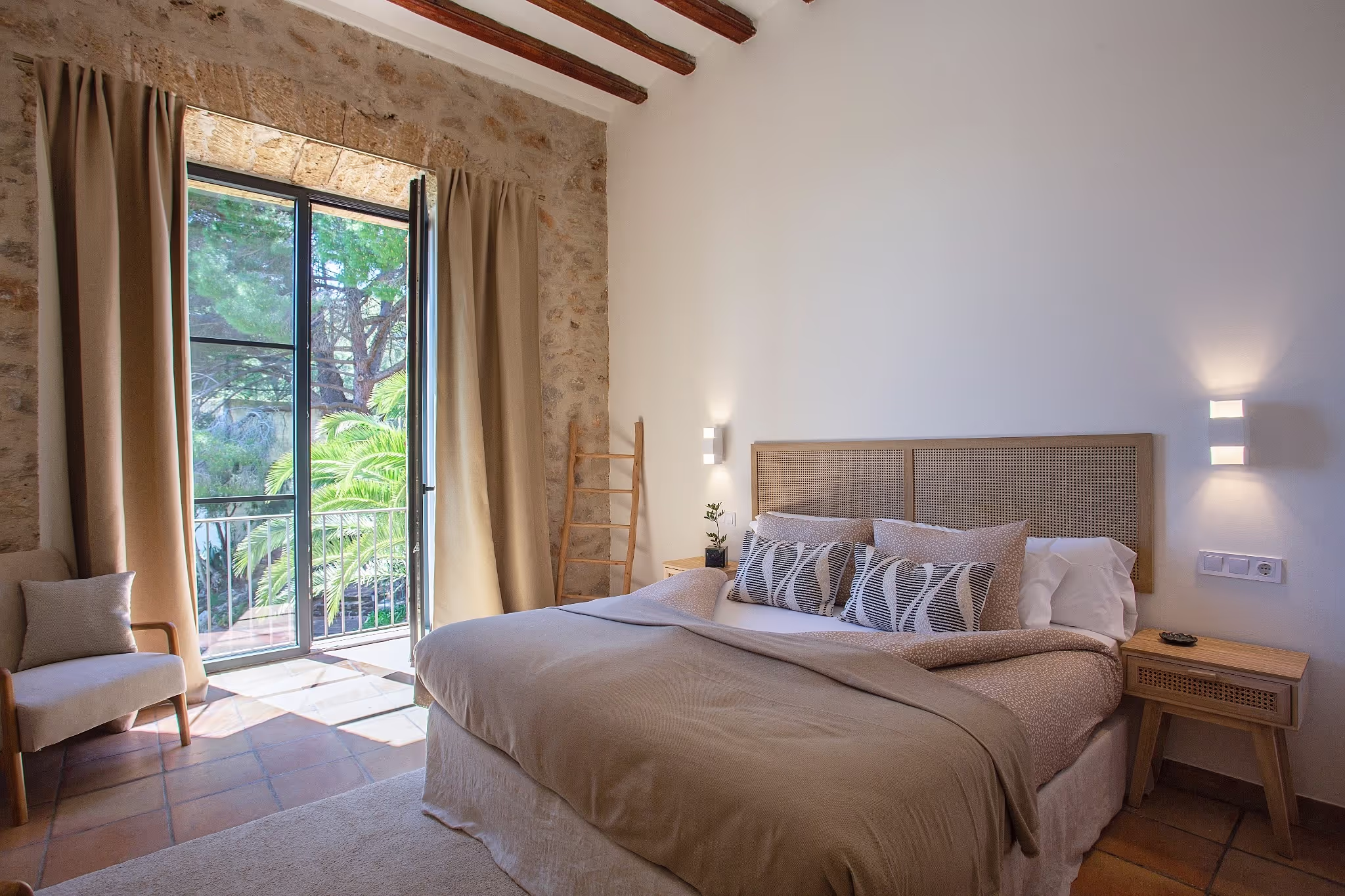 Luxurious king-size bed with pristine white linens and decorative pillows