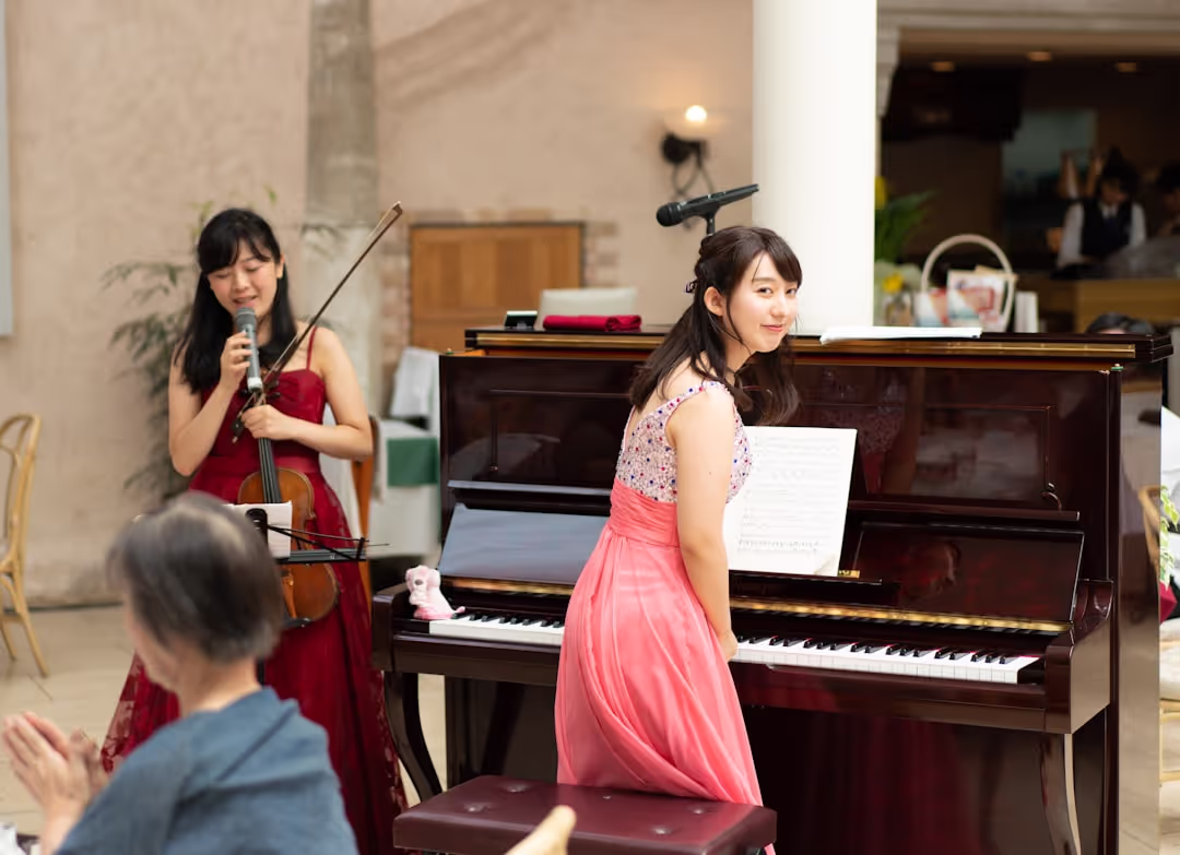 Student performing on a grand piano